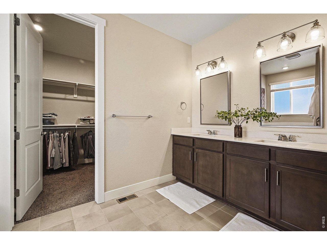 1699 Rivergate Way Berthoud, CO 80513 - Photo 14 of 45 a bathroom with a sink and a mirror
