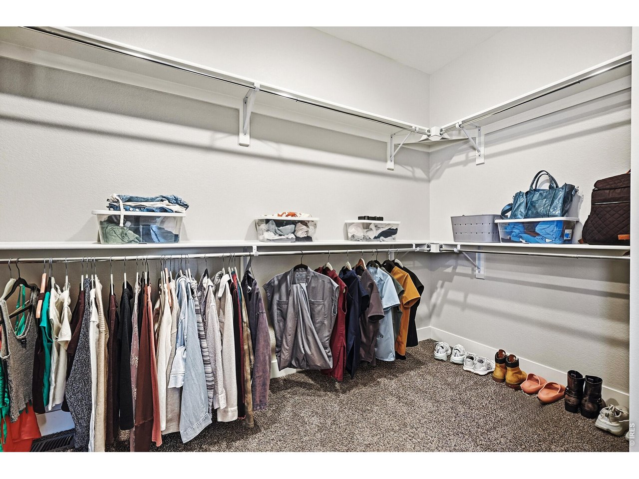 1699 Rivergate Way Berthoud, CO 80513 - Photo 16 of 45 a view of walk in closet with clothes