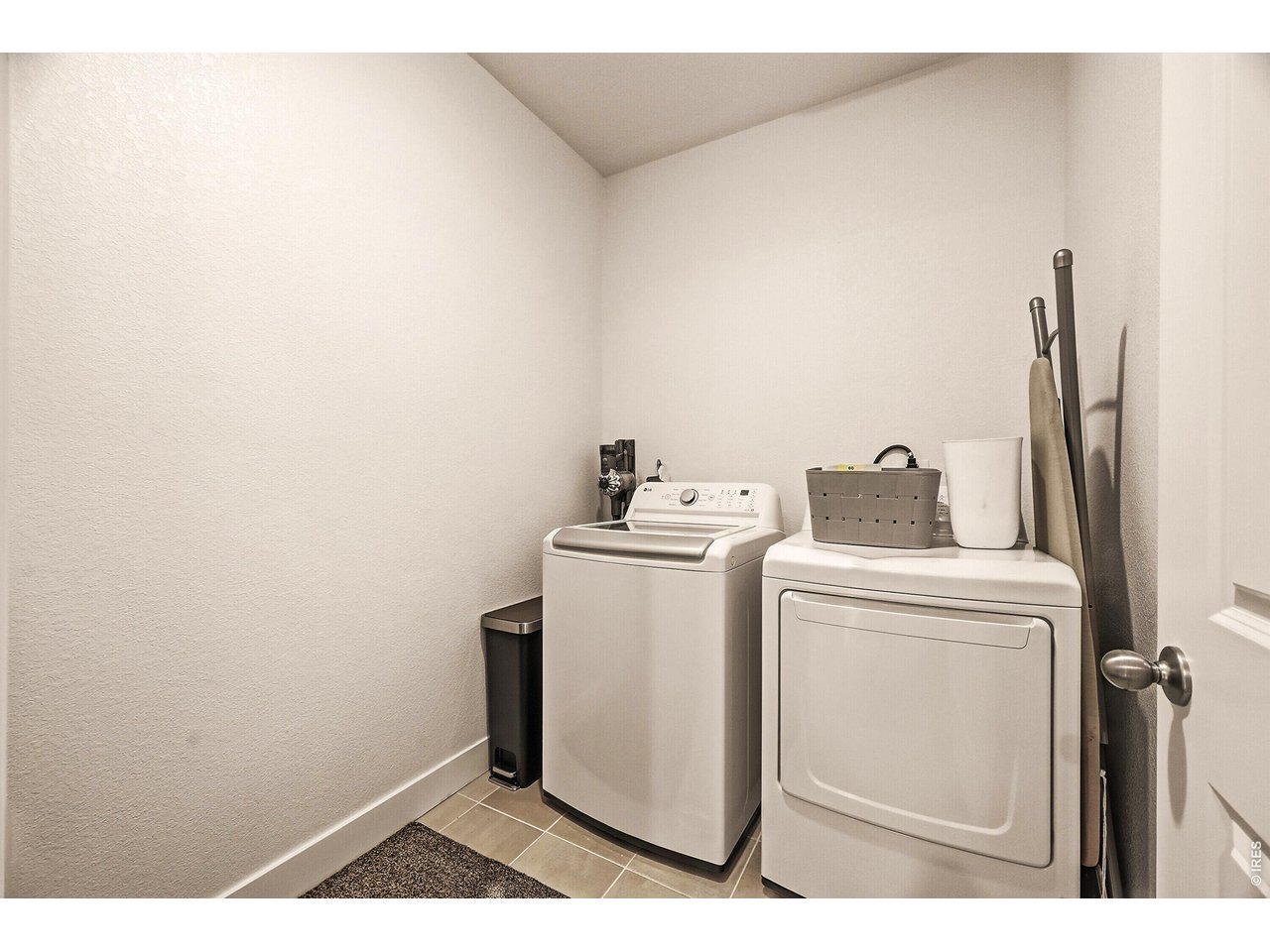 1699 Rivergate Way Berthoud, CO 80513 - Photo 20 of 45 a utility room with dryer and washer