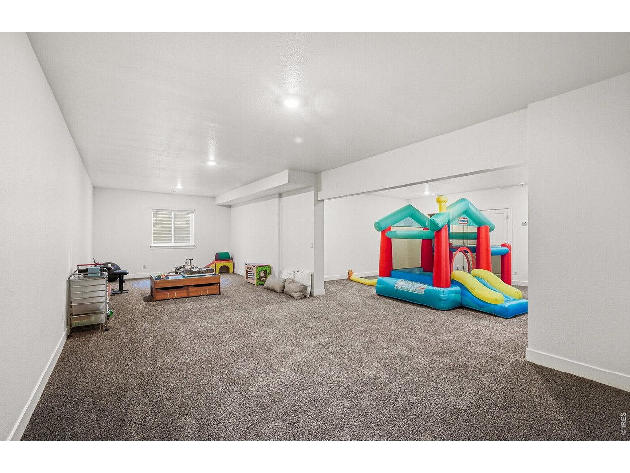 1699 Rivergate Way Berthoud, CO 80513 - Photo 21 of 45 a view of play room with toys and toys