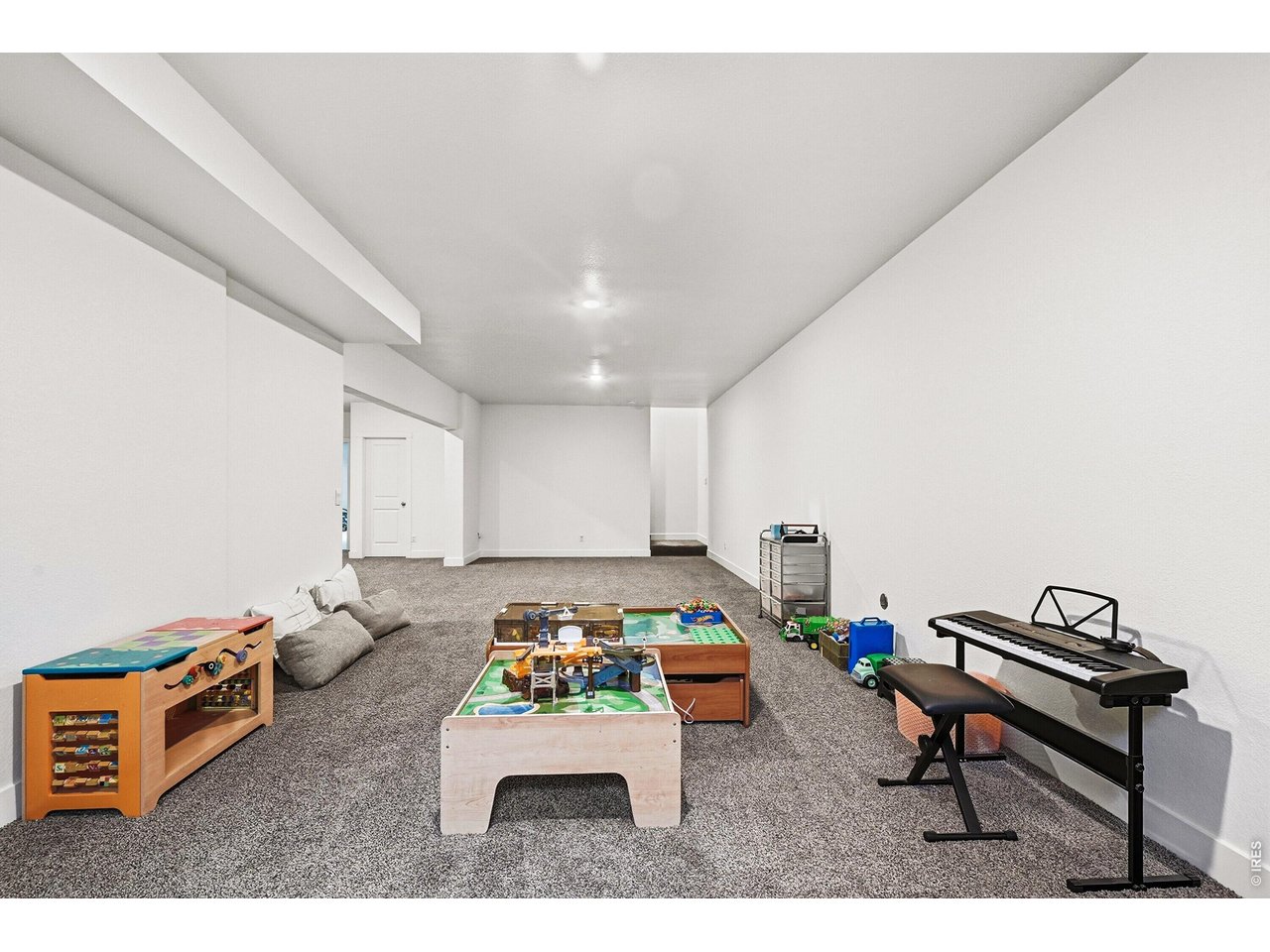 1699 Rivergate Way Berthoud, CO 80513 - Photo 23 of 45 a room with furniture