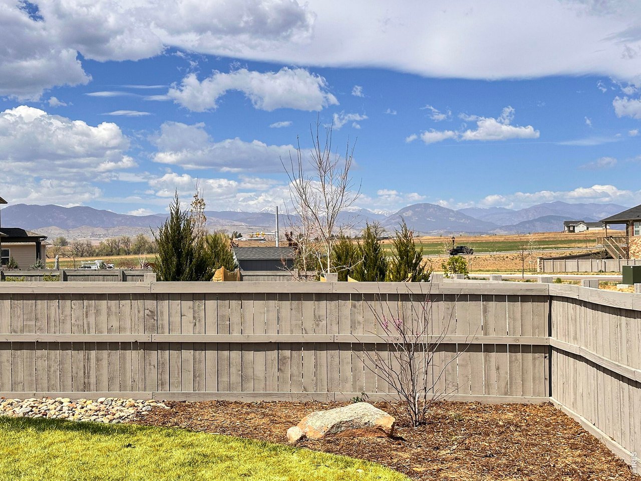 1699 Rivergate Way Berthoud, CO 80513 - Photo 30 of 45 a view of outdoor space with swimming pool and mountain view