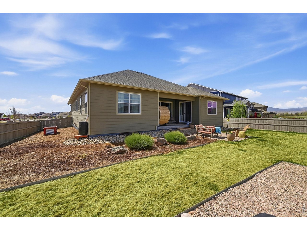 1699 Rivergate Way Berthoud, CO 80513 - Photo 32 of 45 a view of a house with backyard porch and sitting area