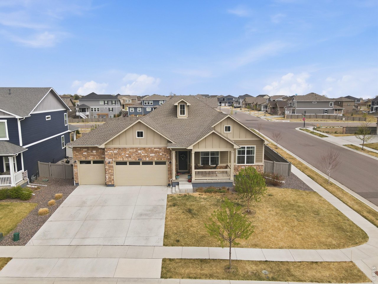 1699 Rivergate Way Berthoud, CO 80513 - Photo 37 of 45 a view of a big house with a mountain in the background