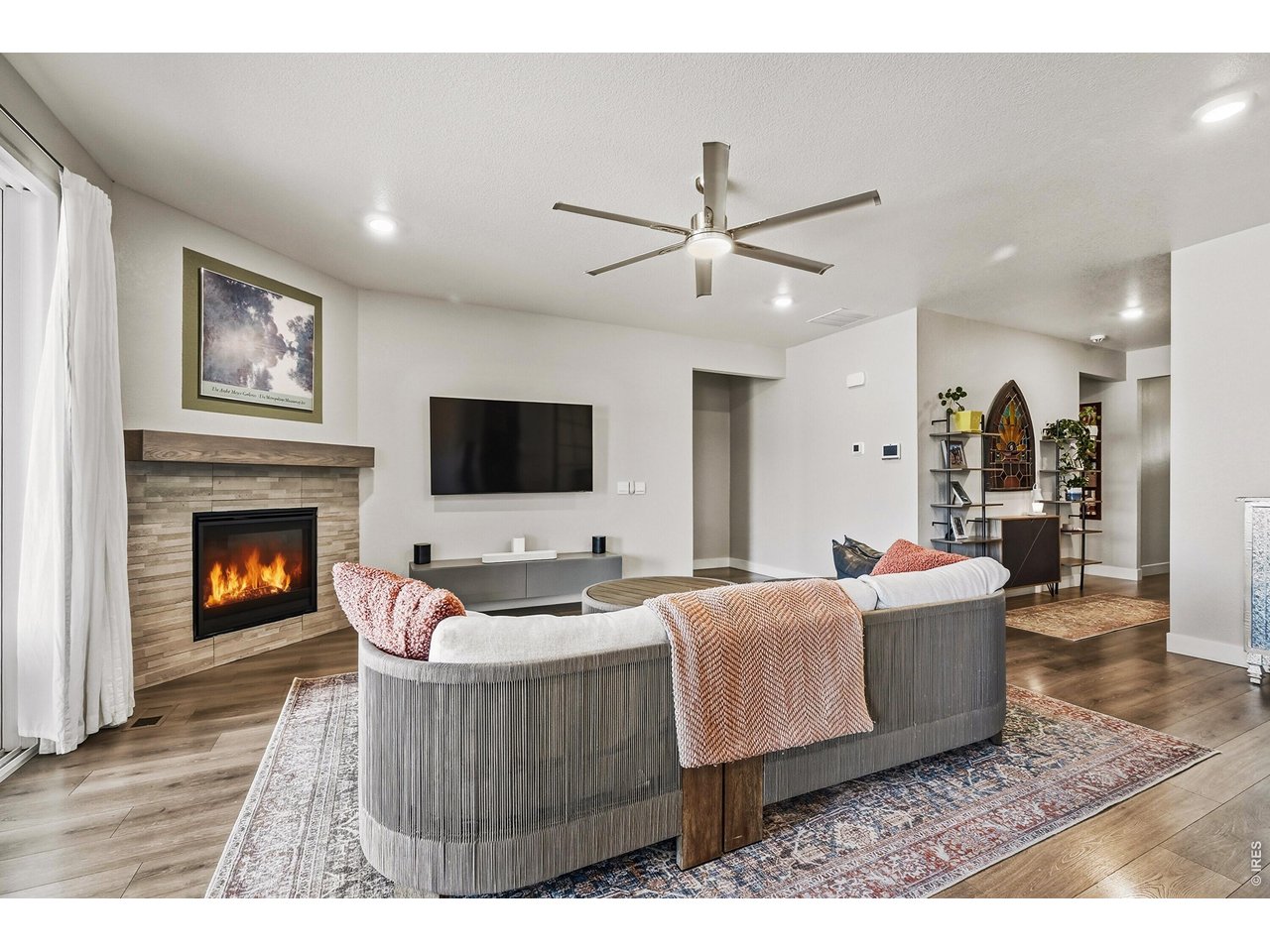 1699 Rivergate Way Berthoud, CO 80513 - Photo 5 of 45 a living room with furniture and a fireplace