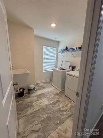 a utility room with cabinets