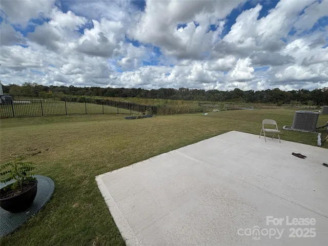 a view of a lake with a yard