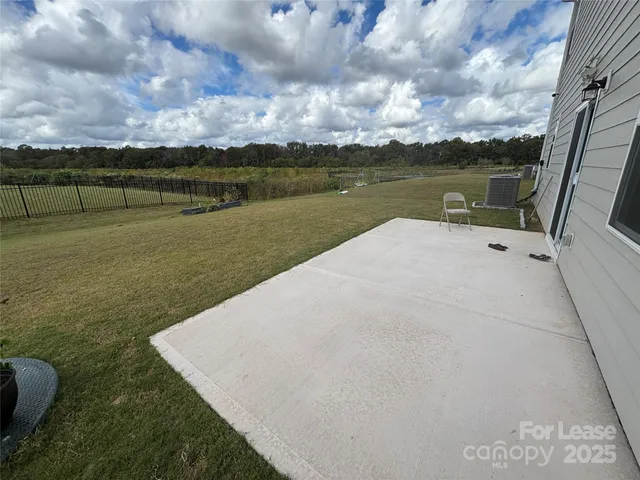 a view of a lake with a yard