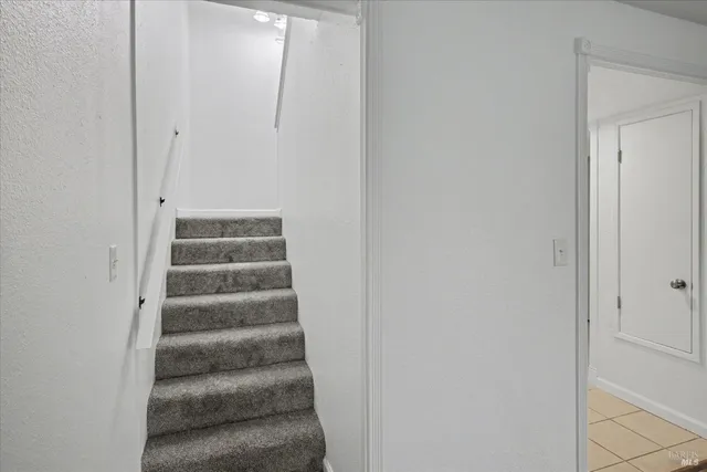 a view of staircase with white walls