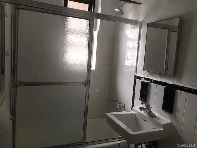 a bathroom with a sink and mirror