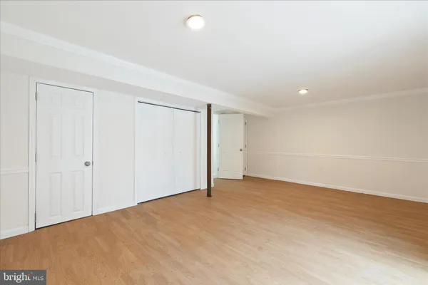 a utility room with cabinets washer and dryer
