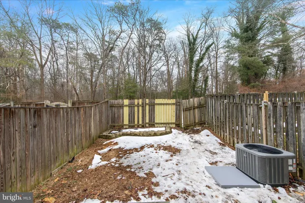 a view of a wooden fence next to a house