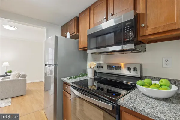 a kitchen with a stove and a microwave