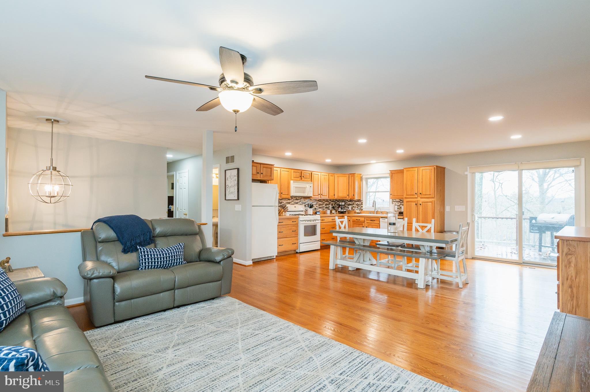 308 Cree Terrace Rising Sun, MD 21911 - Photo 12 of 51 a living room with furniture and a large window with kitchen view