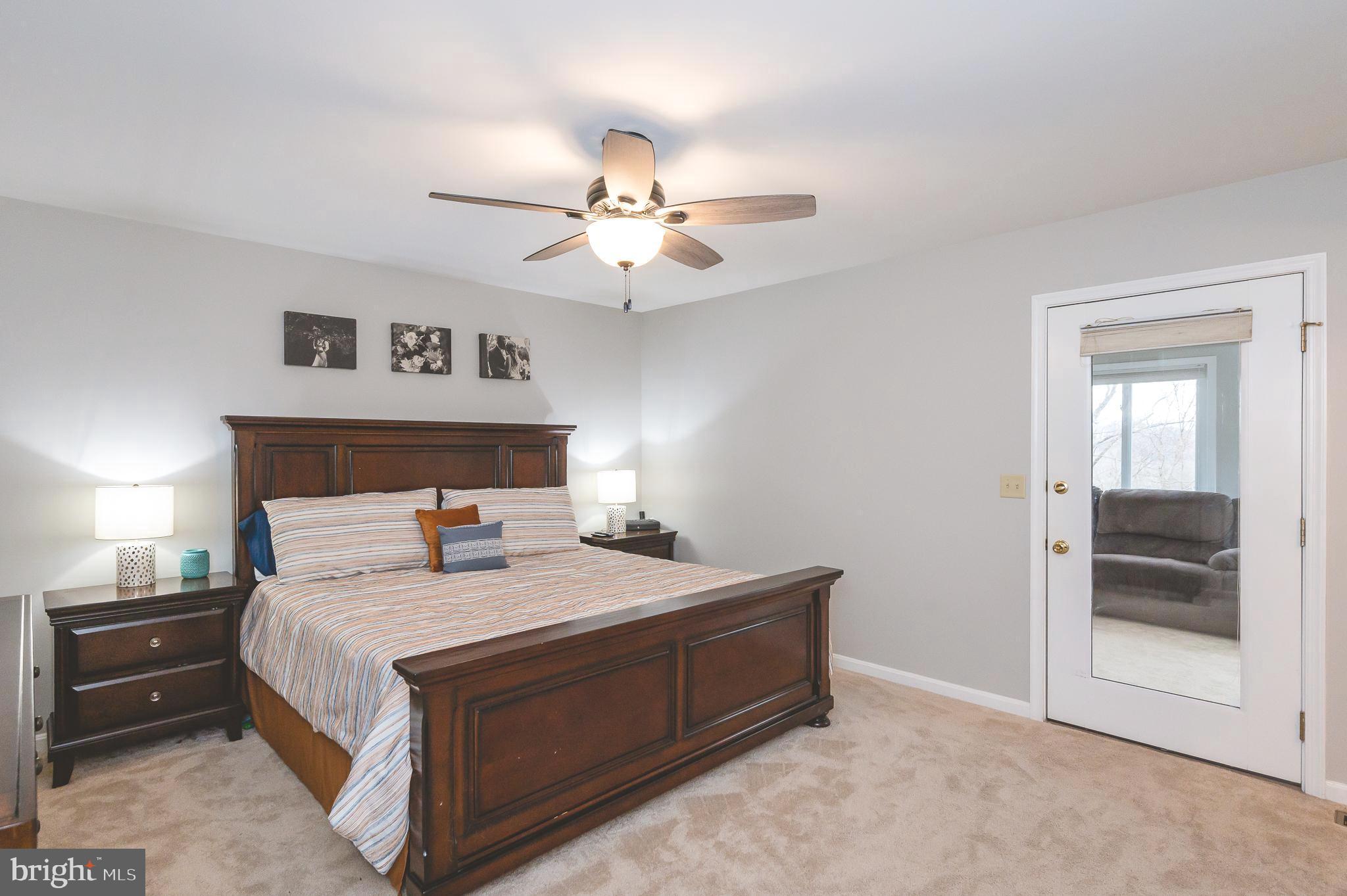 308 Cree Terrace Rising Sun, MD 21911 - Photo 20 of 51 a bedroom with a bed and a chandelier