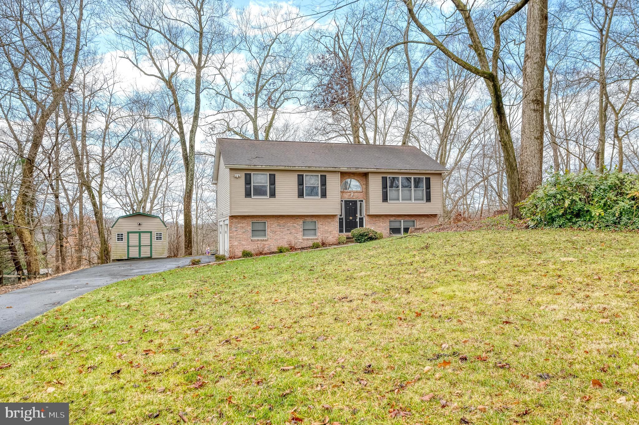 308 Cree Terrace Rising Sun, MD 21911 - Photo 2 of 51 a yellow house sitting in middle of the middle of a yard