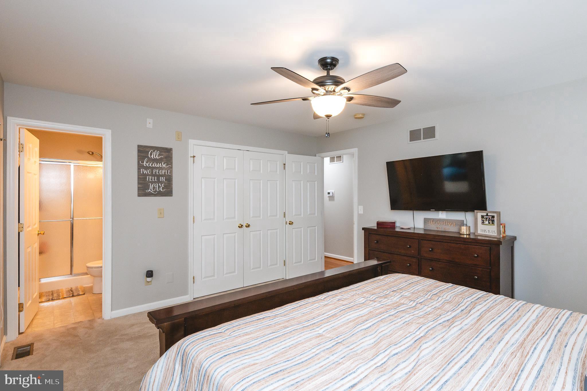 308 Cree Terrace Rising Sun, MD 21911 - Photo 22 of 51 a bedroom with a bed and a flat screen tv