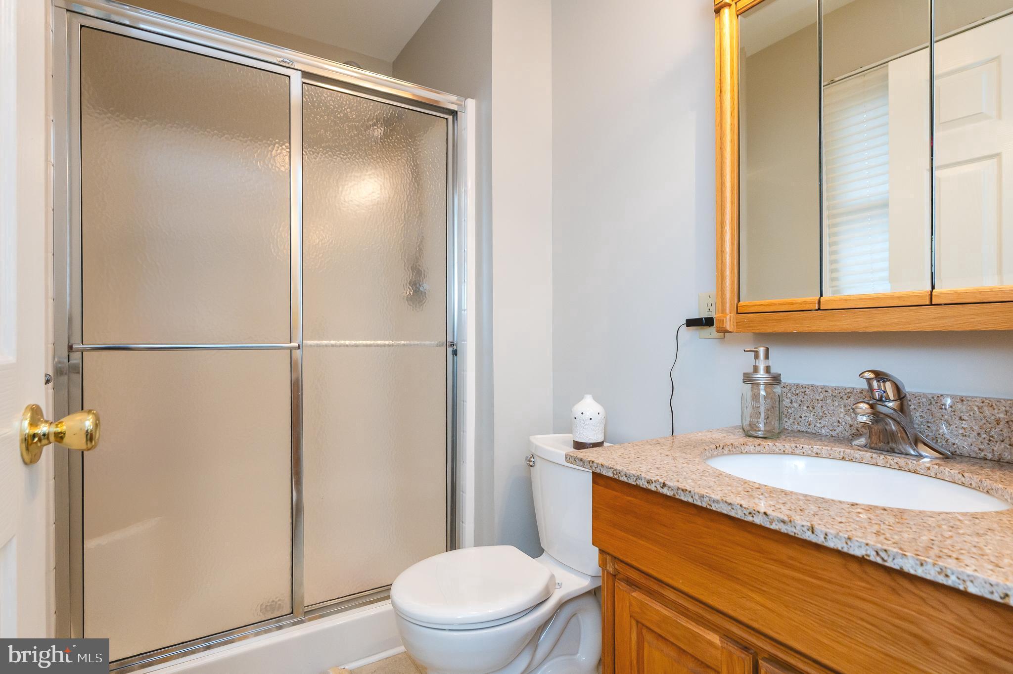 308 Cree Terrace Rising Sun, MD 21911 - Photo 24 of 51 a bathroom with a granite countertop sink toilet and shower