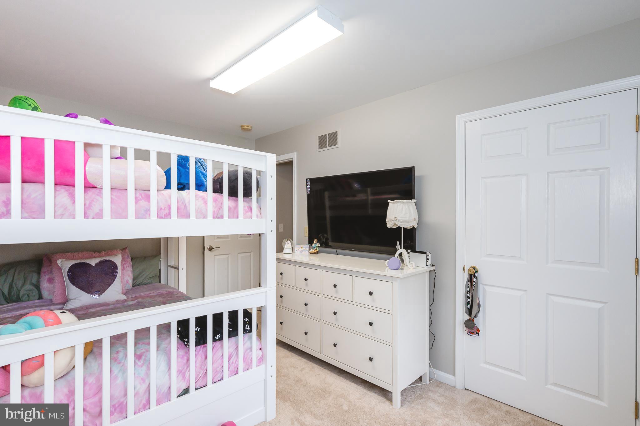 308 Cree Terrace Rising Sun, MD 21911 - Photo 27 of 51 a bedroom with furniture and a flat screen tv
