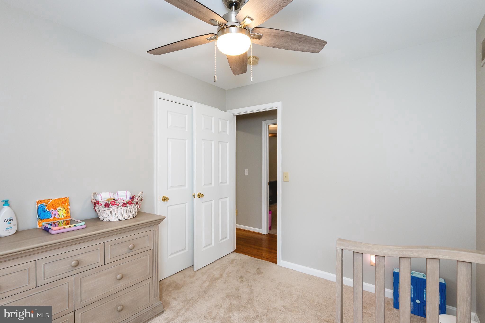 308 Cree Terrace Rising Sun, MD 21911 - Photo 31 of 51 a bedroom with a bed and a chandelier fan