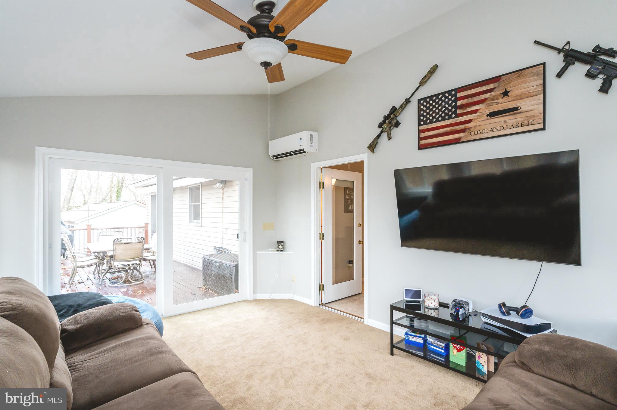 308 Cree Terrace Rising Sun, MD 21911 - Photo 34 of 51 a living room with furniture and a flat screen tv