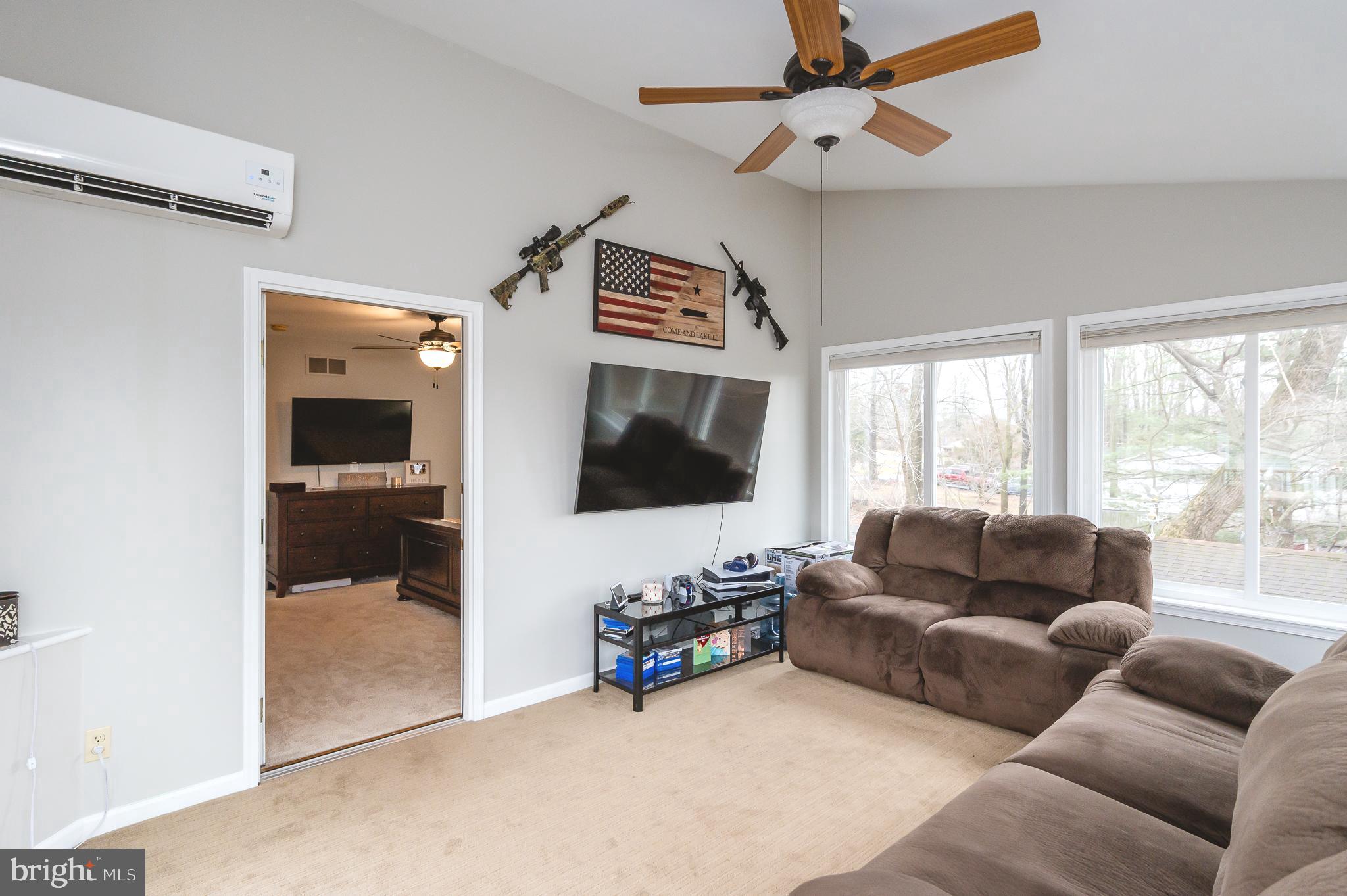 308 Cree Terrace Rising Sun, MD 21911 - Photo 35 of 51 a living room with furniture and a flat screen tv