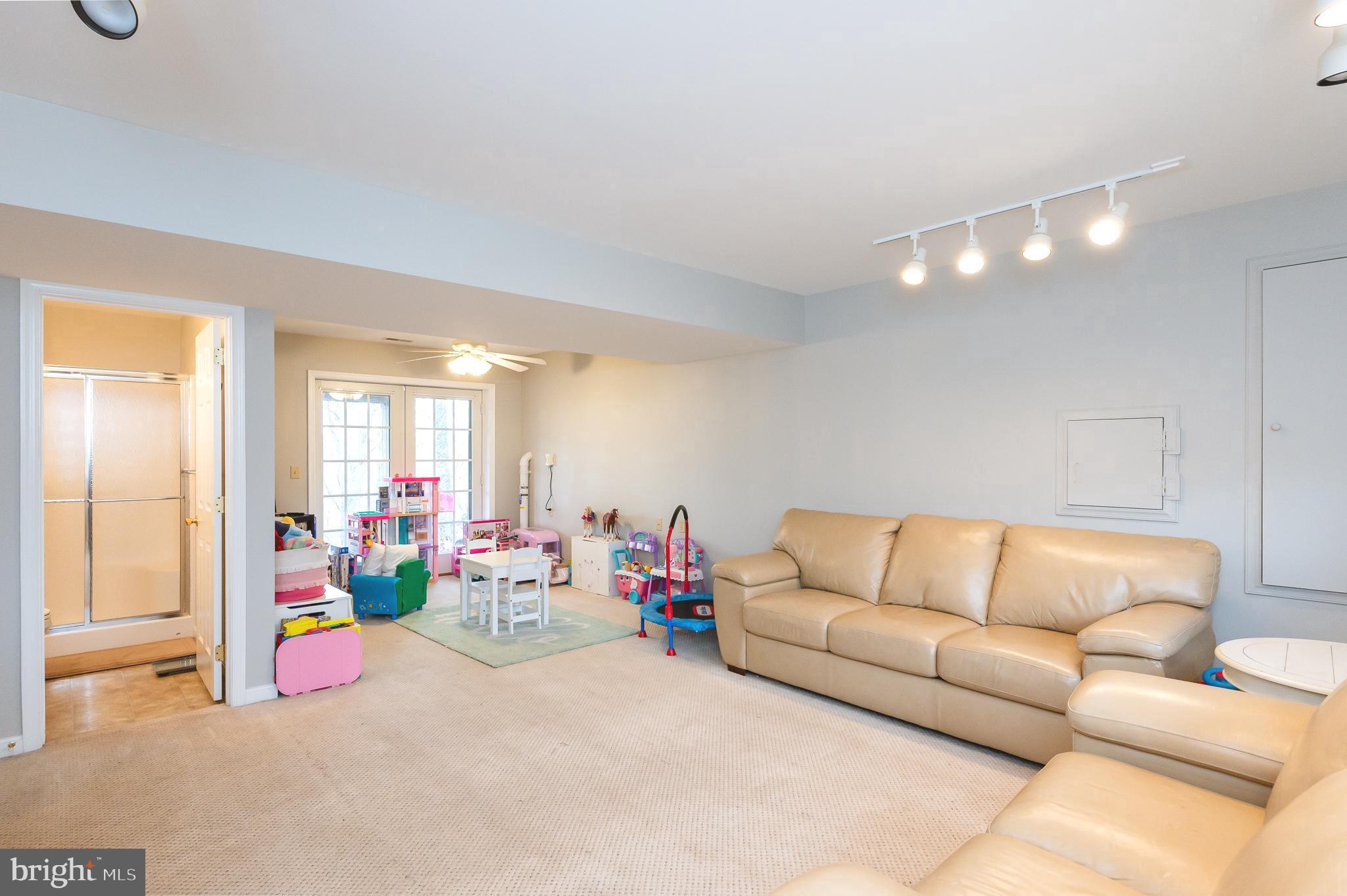 308 Cree Terrace Rising Sun, MD 21911 - Photo 38 of 51 a living room with furniture and a flat screen tv