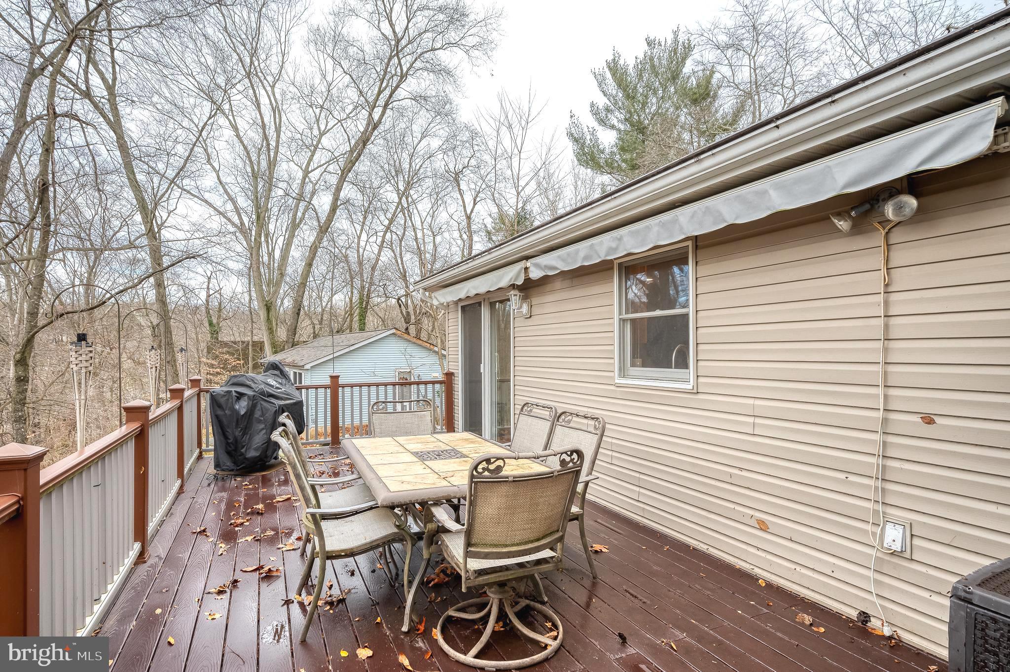 308 Cree Terrace Rising Sun, MD 21911 - Photo 45 of 51 a patio with table and chairs and potted plants with wooden floor and fence