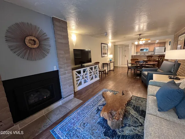 a living room with furniture and a fireplace or television