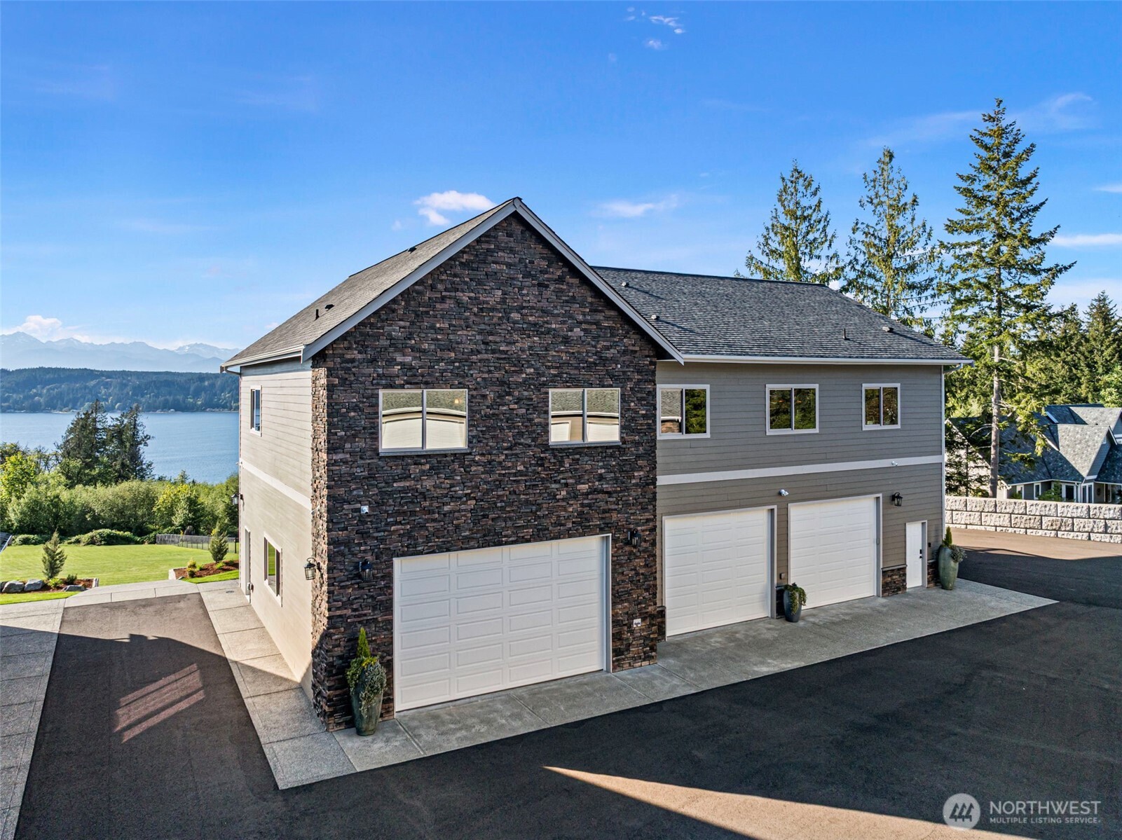 151 East Windy Ridge Lane Belfair, WA 98528 - Photo 29 of 40 a front view of a house with a yard