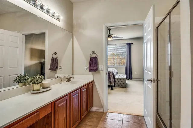 a bathroom with a double vanity sink and a mirror