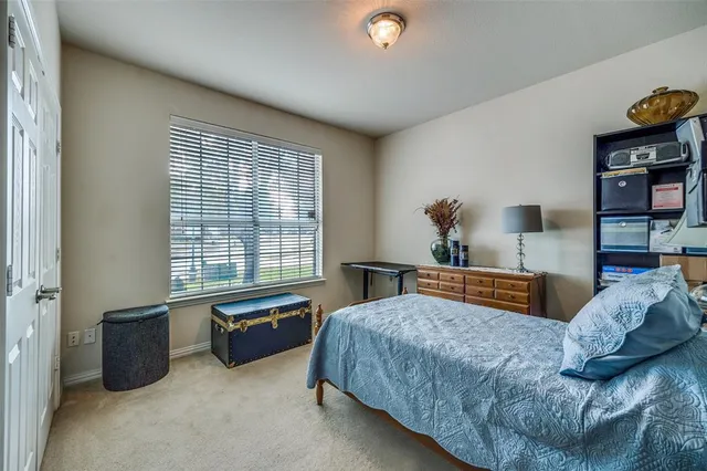 a bathroom with a sink a toilet a mirror and shower curtain