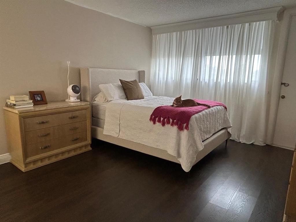 16325 Golf Club Road, Unit 109 Weston, FL 33326 - Photo 19 of 20 a bed sitting in a bedroom next to a window