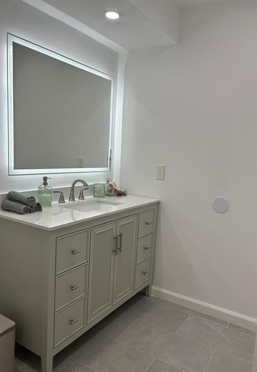 16325 Golf Club Road, Unit 109 Weston, FL 33326 - Photo 20 of 20 a bathroom with a double vanity sink and a mirror