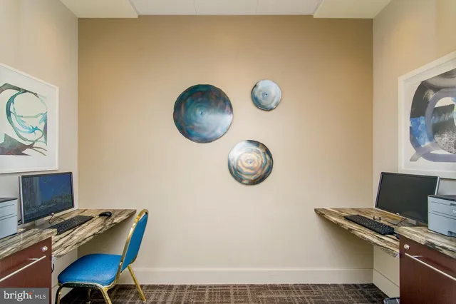 a front view of a building with a garden and plants