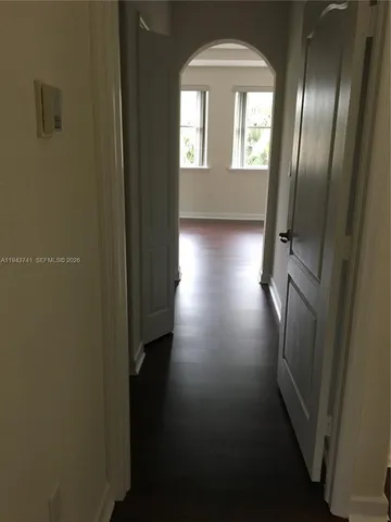 a white toilet sitting next to a shower curtain