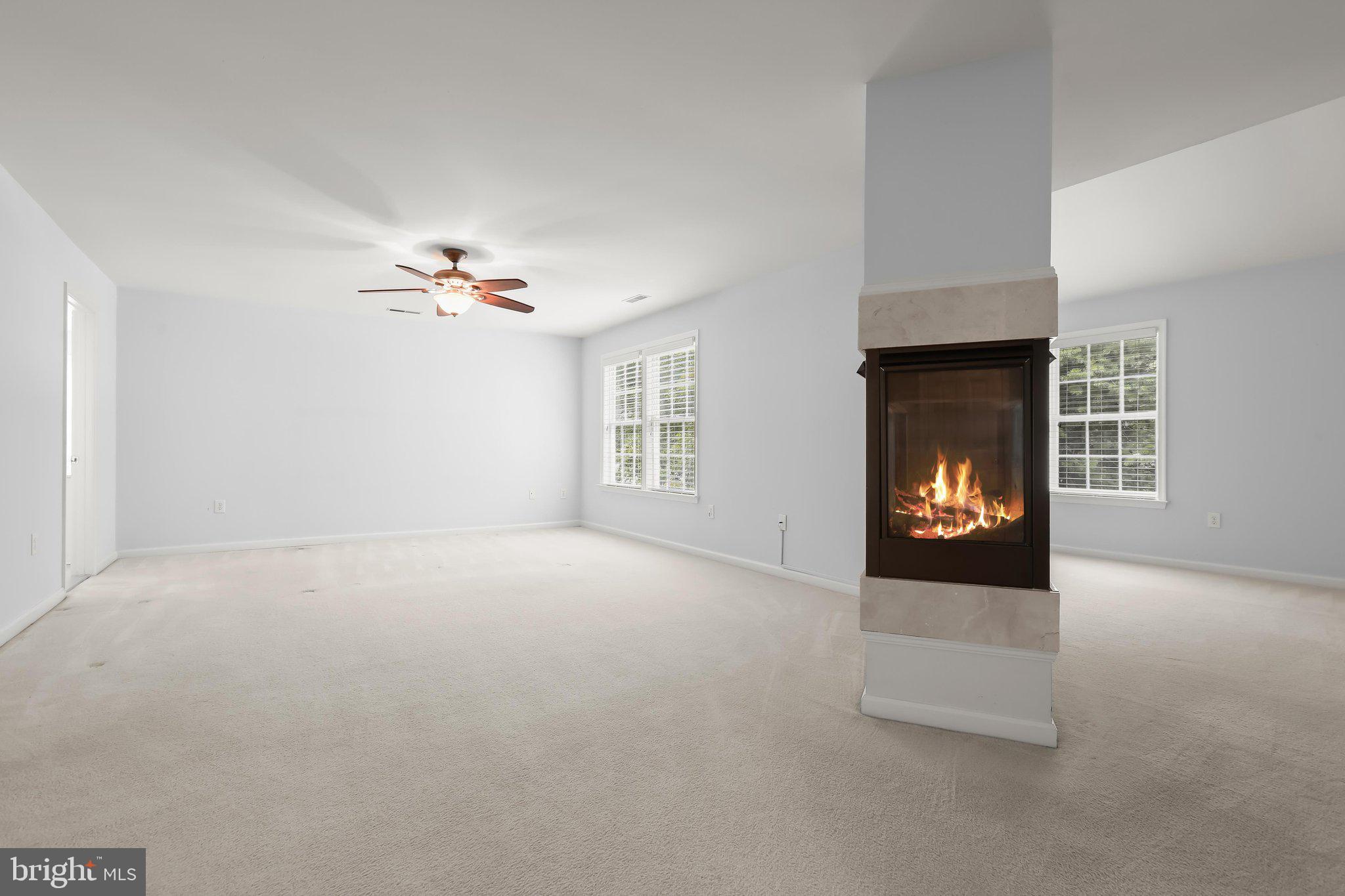 6111 Rippling Tides Terrace Clarksville, MD 21029 - Photo 41 of 84 a view of an empty room with a fireplace and window