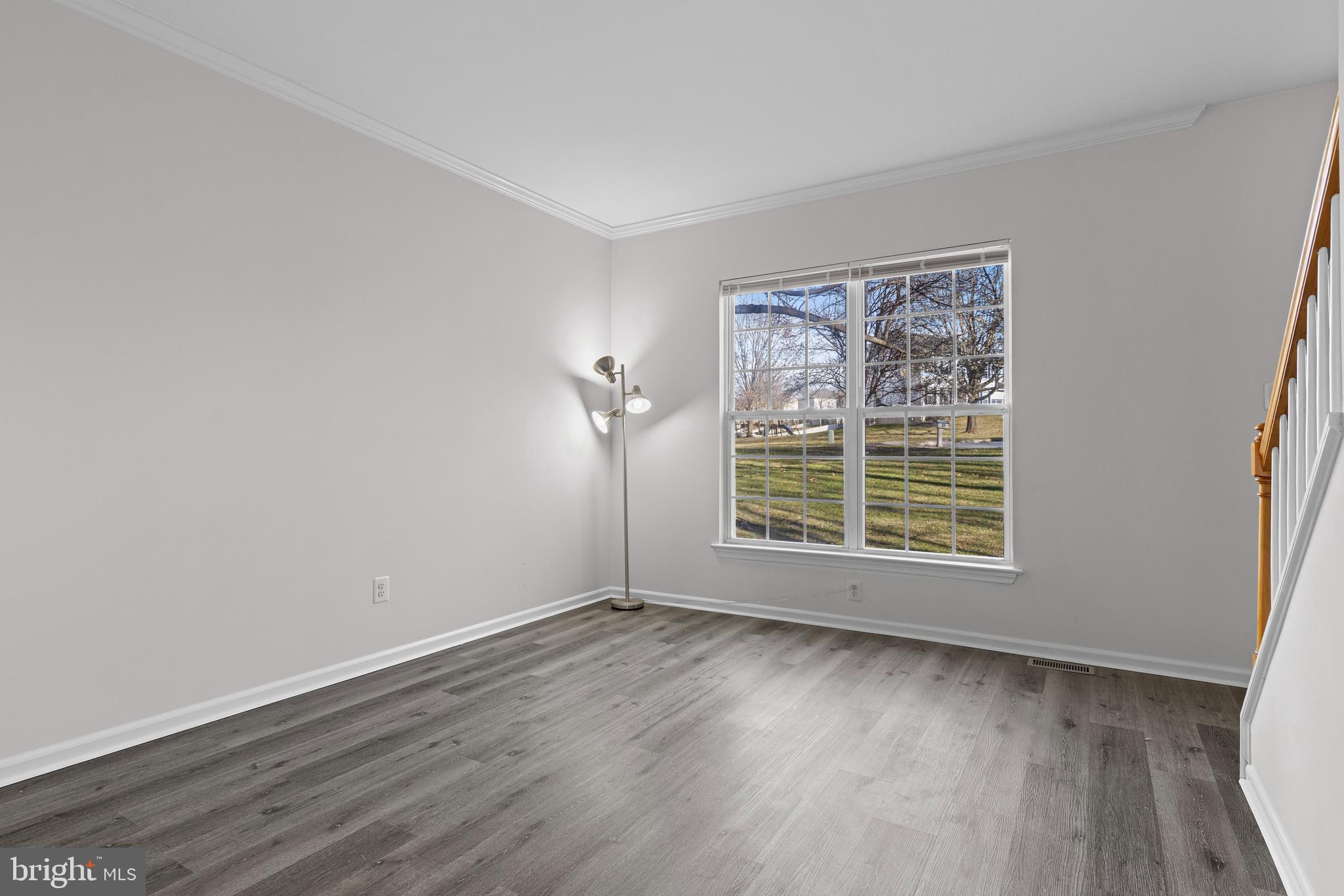 360 Yorklyn Road Oxford, PA 19363 - Photo 16 of 54 an empty room with wooden floor and windows