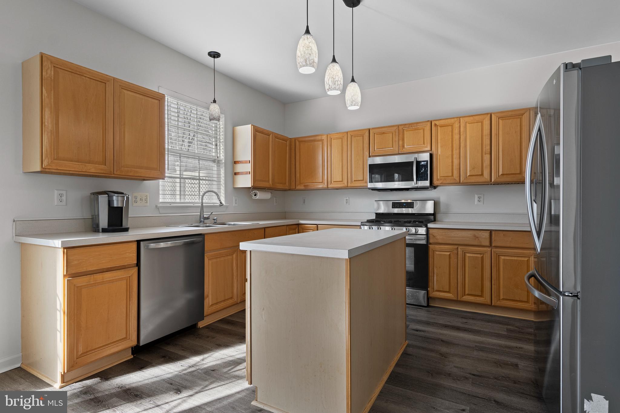 360 Yorklyn Road Oxford, PA 19363 - Photo 19 of 54 a kitchen with a sink stove microwave and refrigerator