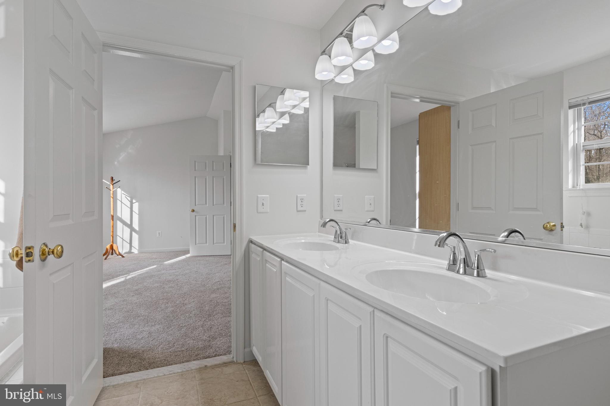 360 Yorklyn Road Oxford, PA 19363 - Photo 41 of 54 a bathroom with a sink a large mirror and a shower