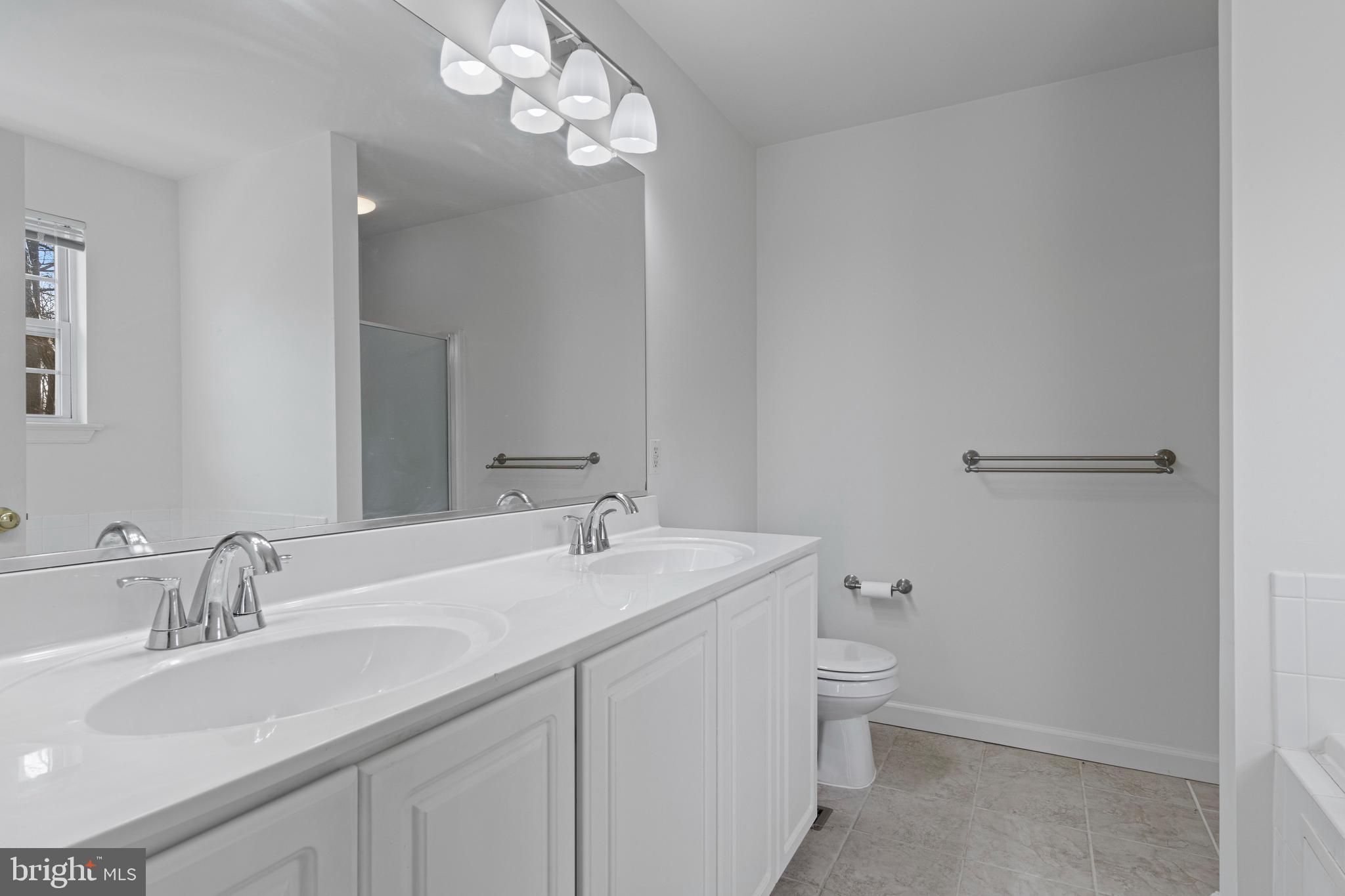 360 Yorklyn Road Oxford, PA 19363 - Photo 43 of 54 a bathroom with a sink a toilet and a mirror
