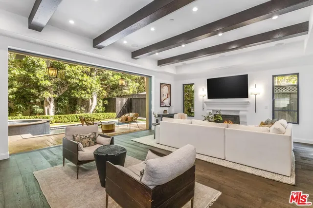 a kitchen with a stove a sink a counter space and a window