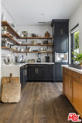 a bedroom with a large bed and a large window