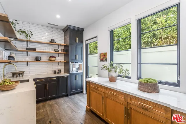 a bedroom with a bed and a fireplace