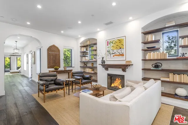 a view of a balcony with table and chairs potted plants