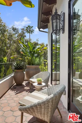 a bedroom with a large bed and couch