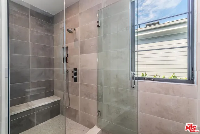 a view of a dining room with furniture and a chandelier