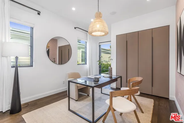 a view of a chairs and table in the patio