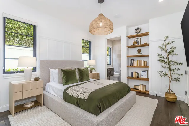 a outdoor living space with furniture and a black umbrella