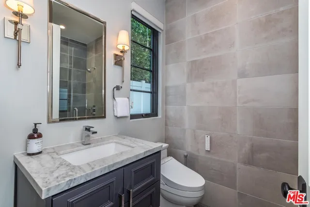 a view of a patio with couches chairs and a potted plant